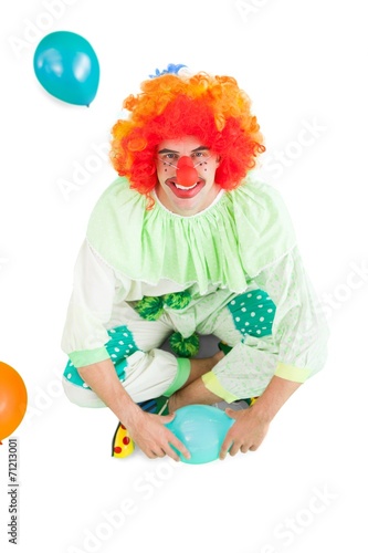 Funny clown smiling at camera