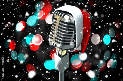 Composite image of microphone with santa hat