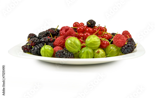 berries in a plate on a white background