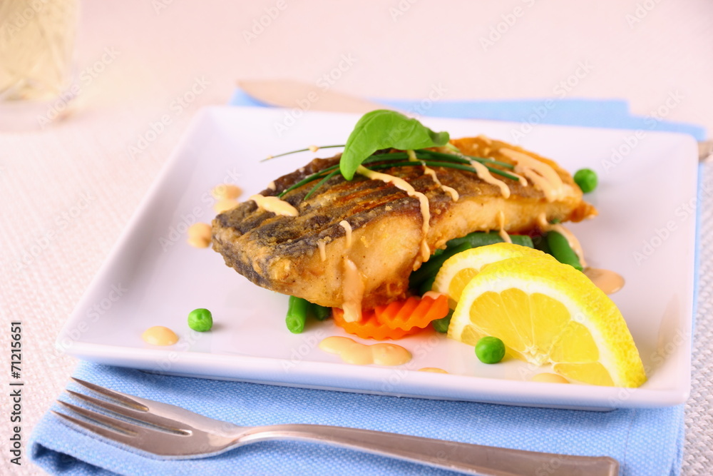 Fried carp fish fillet with vegetables