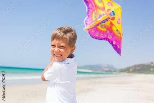 Child flying kite beach outdoor.