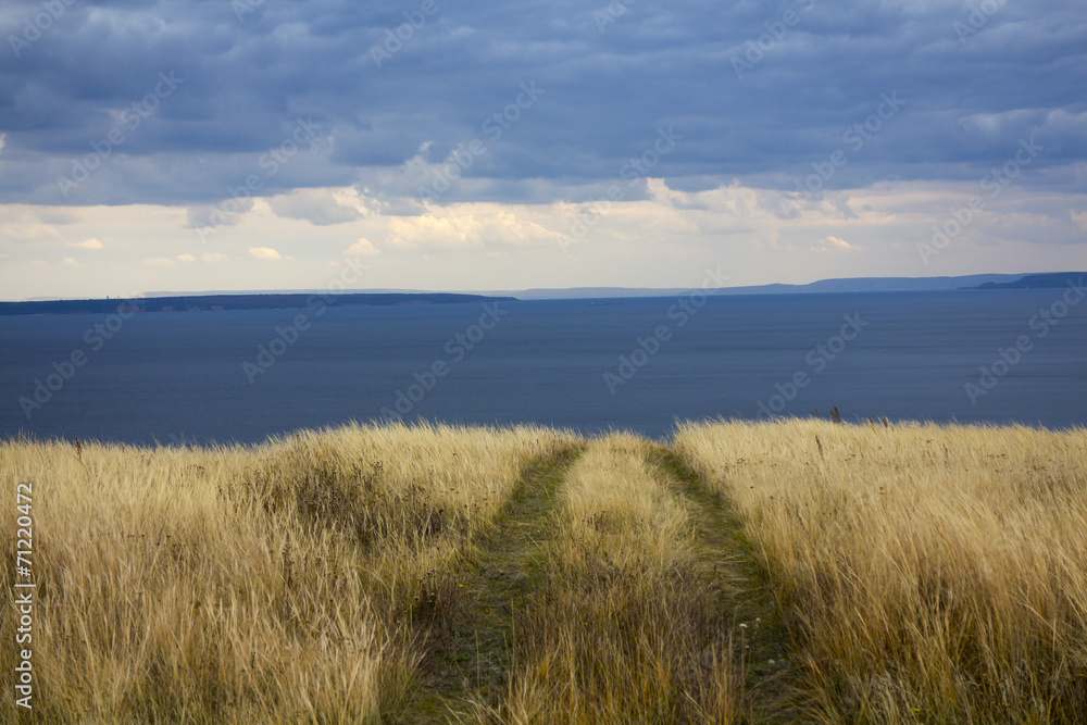 End of the road in the country horizon blue sea and sky End of the road in the country horizon blue sea and sky