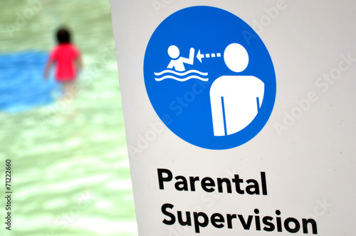 Fotografia Parental supervision in swimming pool