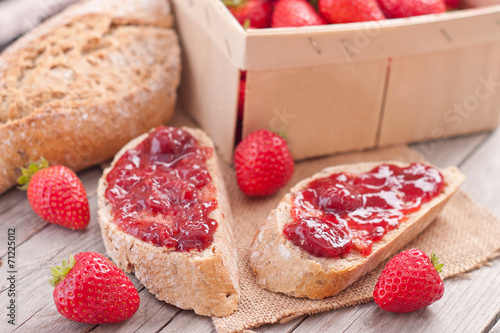 sweet strawberries jam on bread slice. photo