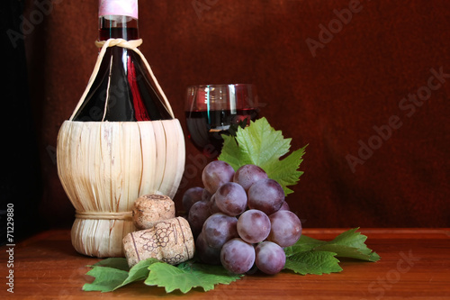 Italian wine Chianti with grape and wine glass