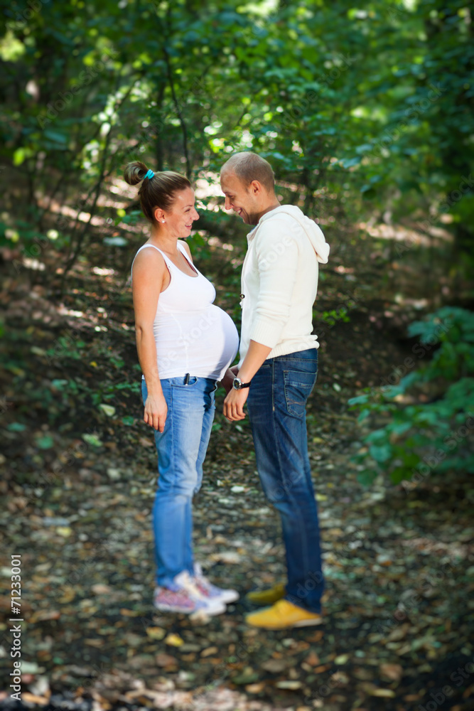 Fototapeta premium Husband and pregnant wife