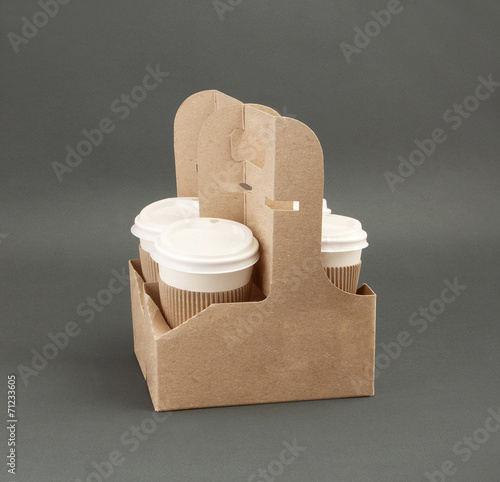 Four take-out coffee in holder