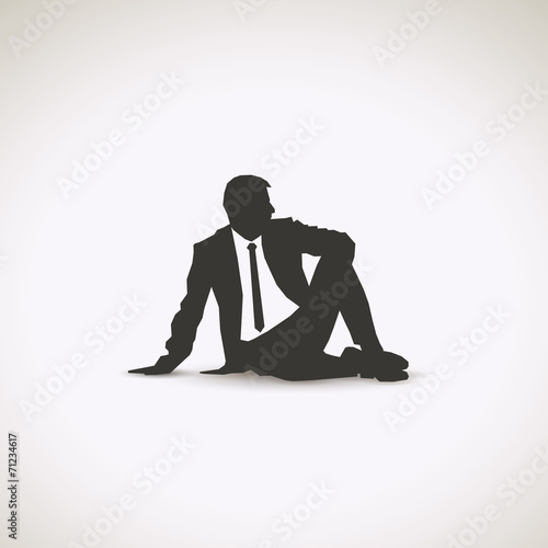 Business man sitting down
