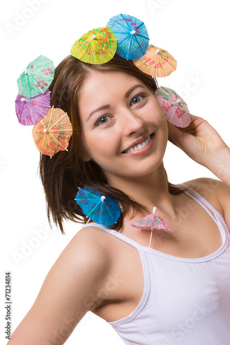 Portrait of happy woman with umbrella for drinks on her head.