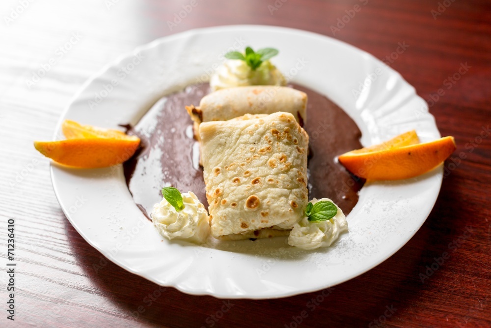 Delicious pancakes with chocolate sauce Delicious pancakes with chocolate sauce