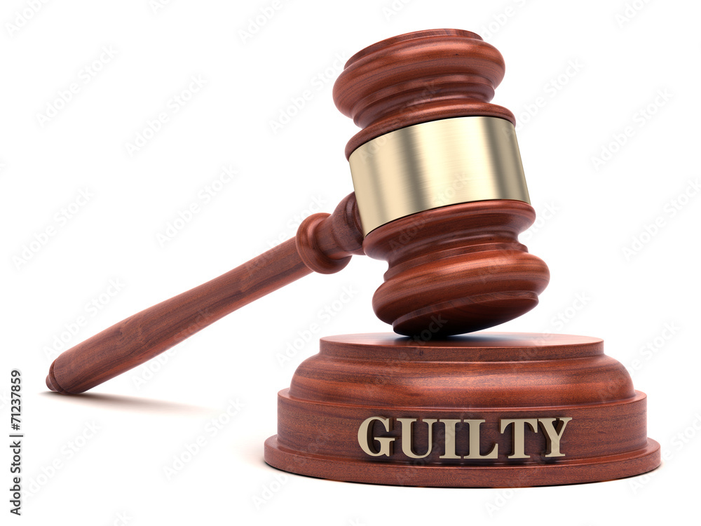 Gavel and GUILT text on sound block Gavel and GUILT text on sound block