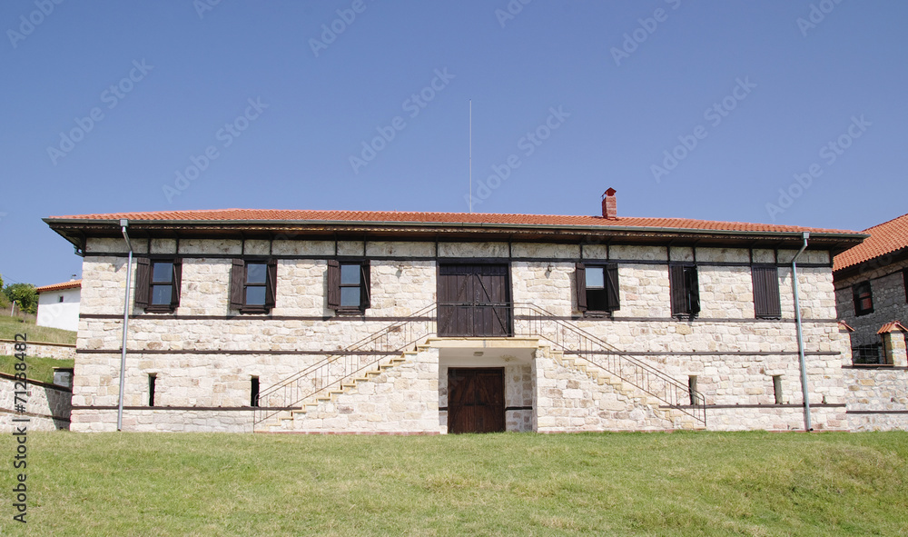 White stone house with stairs