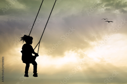 Girl on swing at sunset © adrenalinapura
