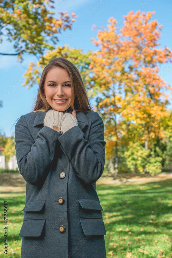 Smiling Pretty Woman Chilling in Gray Coat