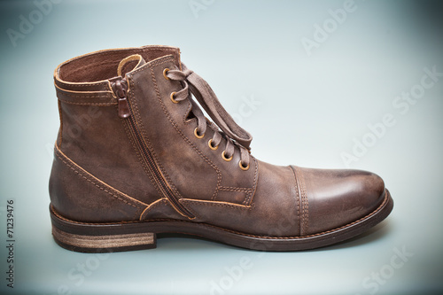 High leather boots brown. Fashionable men's autumn shoes.