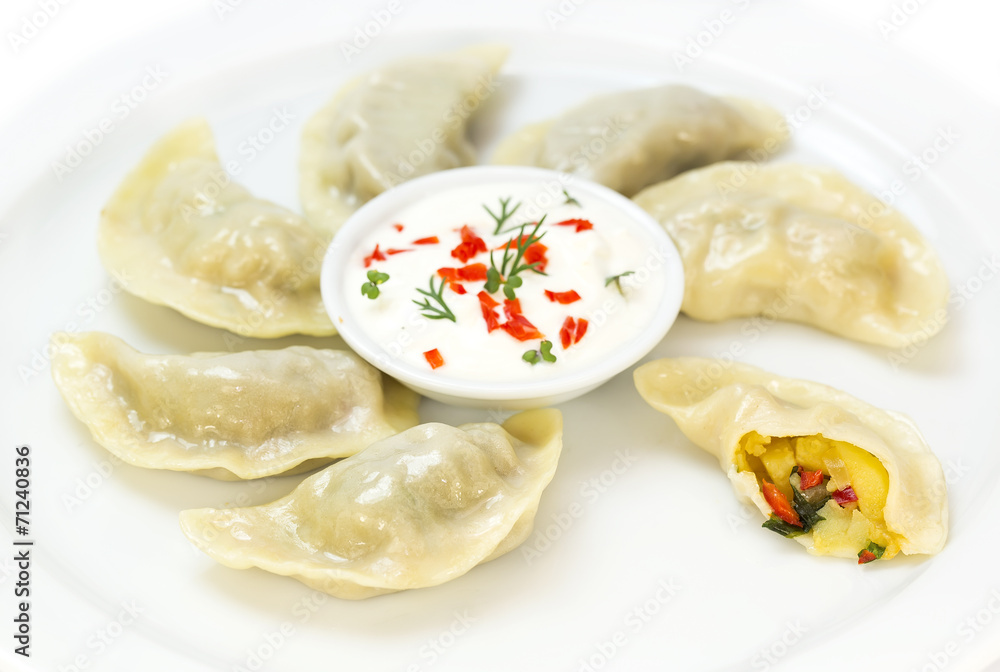 Nepalese food momo on a white background in the restaurant Nepalese food momo on a white background in the restaurant
