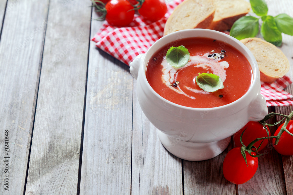 Tasty tomato soup with fresh basil and cream Tasty tomato soup with fresh basil and cream