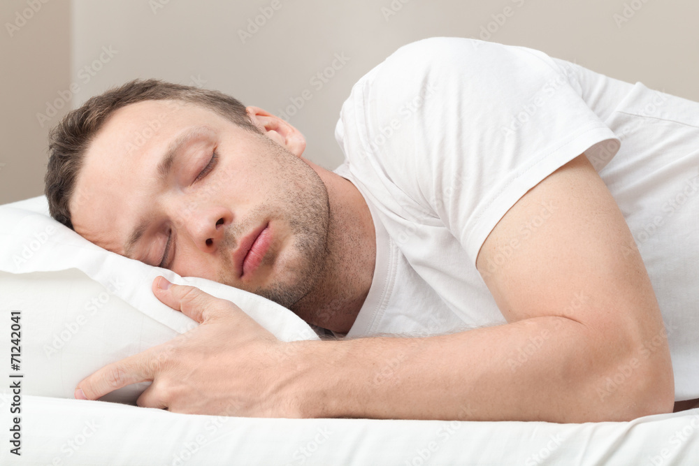 Portrait of sleeping Young Caucasian man in white Portrait of sleeping Young Caucasian man in white
