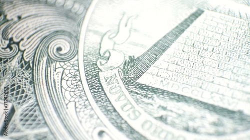 close up view of  dollar currency - eagle to pyramid pan photo