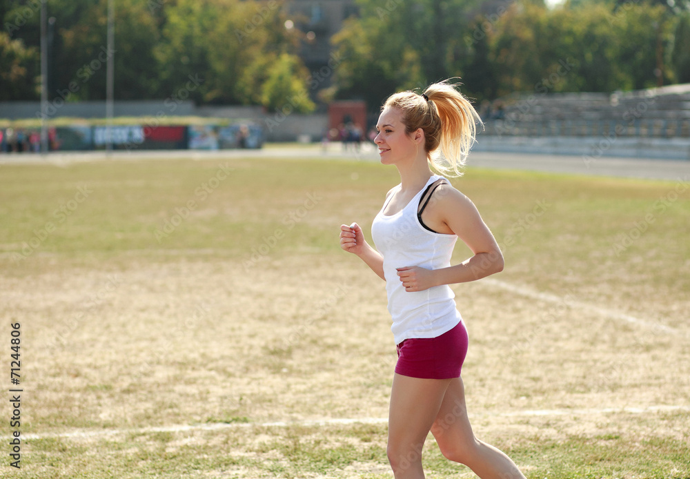Young woman jogging, training run outdoors Young woman jogging, training run outdoors