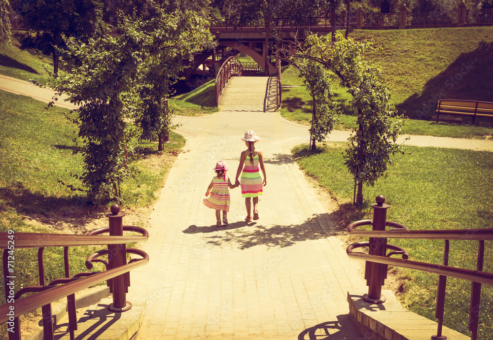 Fototapeta premium vintage portrait of Little girls running with sunset