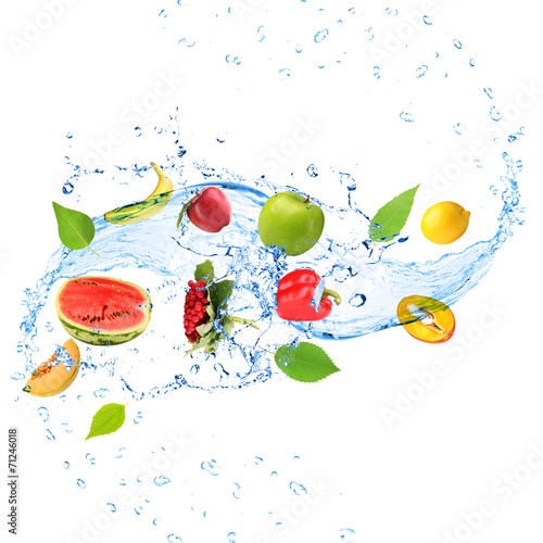 Fresh fruit, vegetables and green leaves with water splash,
