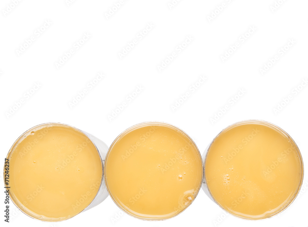 Condensed milk in tin can over white background Condensed milk in tin can over white background
