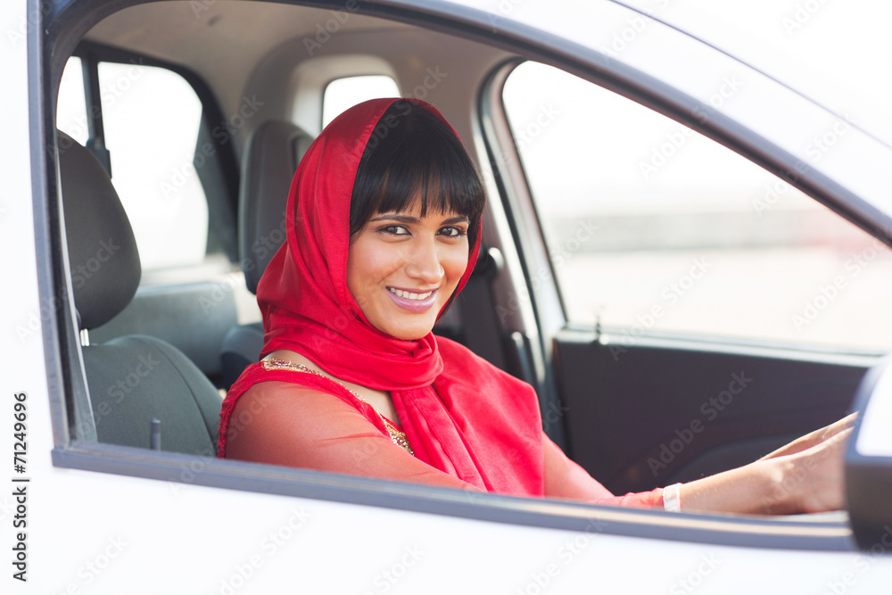 indian woman driver inside a car