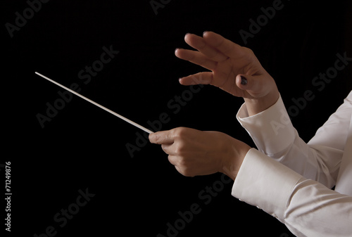 Music female director holding stick