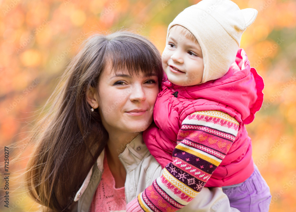 portrait of beautiful mother and child girl outdoors in fall portrait of beautiful mother and child girl outdoors in fall