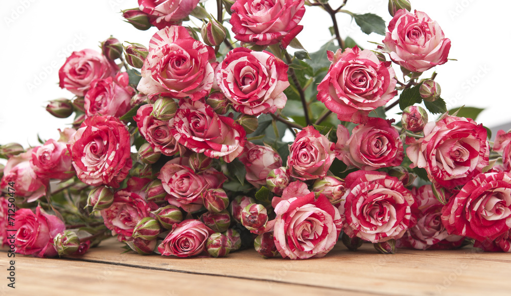 bouquet of roses on wooden table bouquet of roses on wooden table