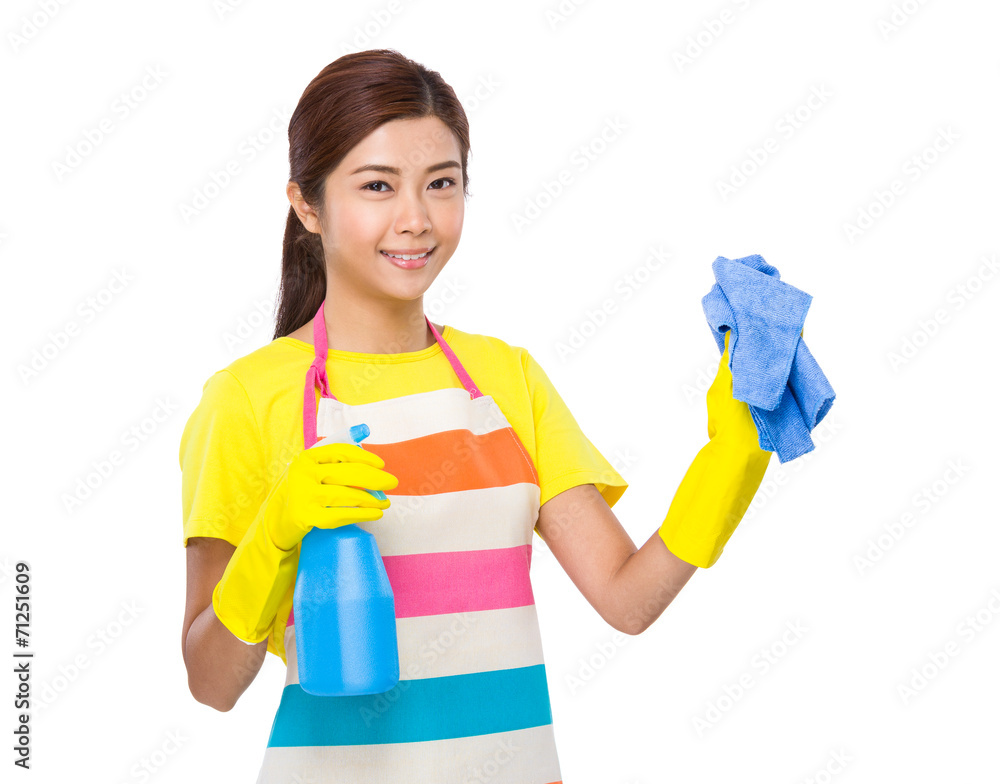 Asian housewife use spray and towel Asian housewife use spray and towel