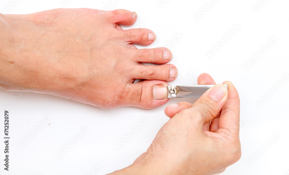 woman cutting toenail. woman cutting toenail.