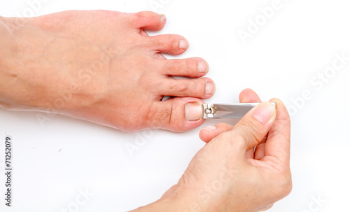 woman cutting toenail.