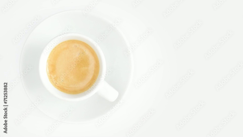 cup of coffee rotating overhead on white background cup of coffee rotating overhead on white background