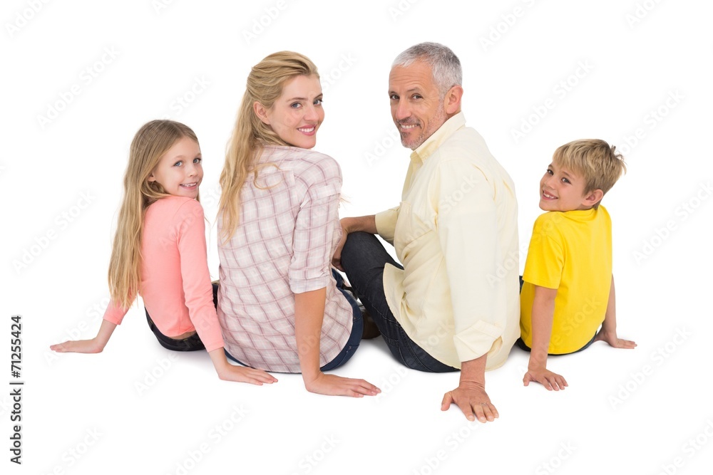 Obraz premium Happy family sitting and smiling