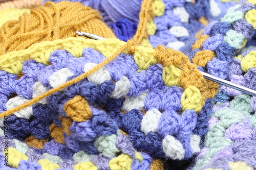 Crocheting an afghan blanket, shades og blue and brown © elm98