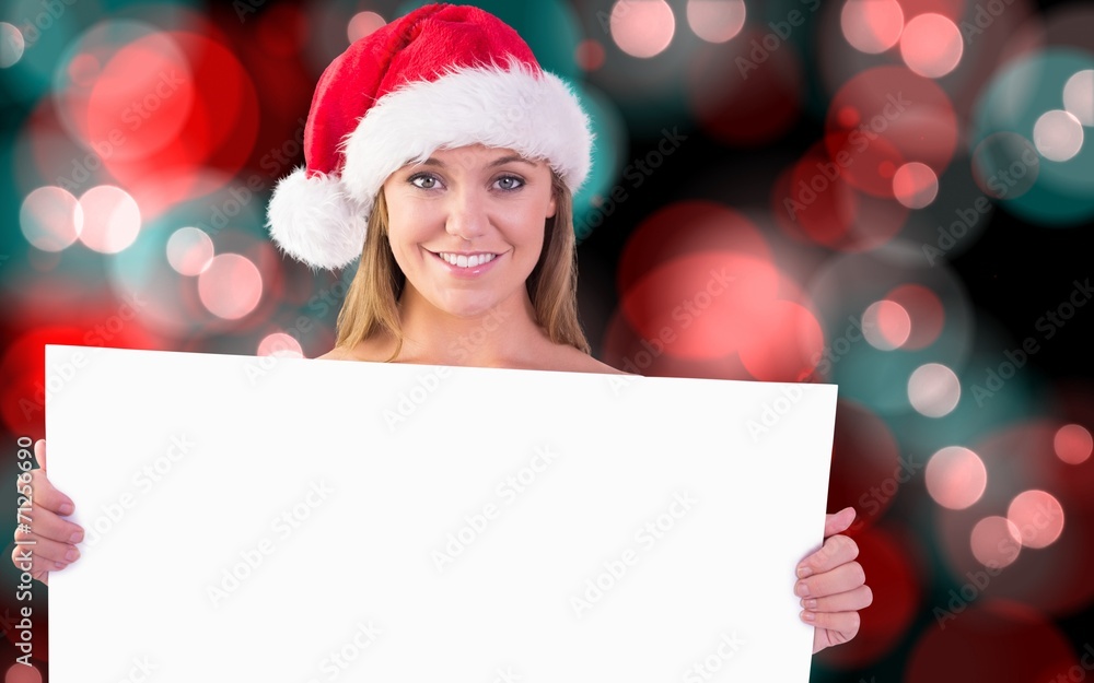 Composite image of festive blonde smiling at camera Composite image of festive blonde smiling at camera