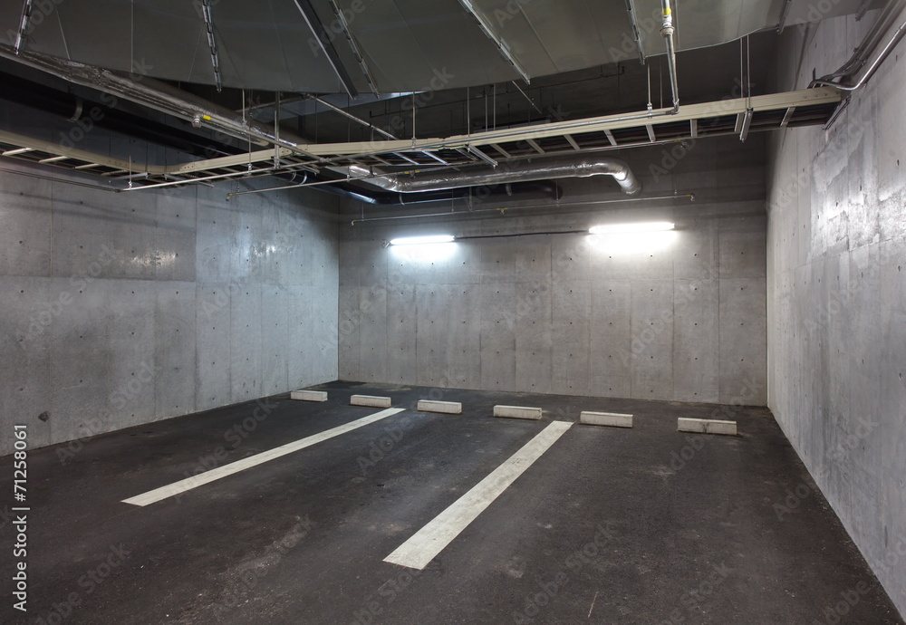 Parking garage underground interior, neon lights in dark Parking garage underground interior, neon lights in dark