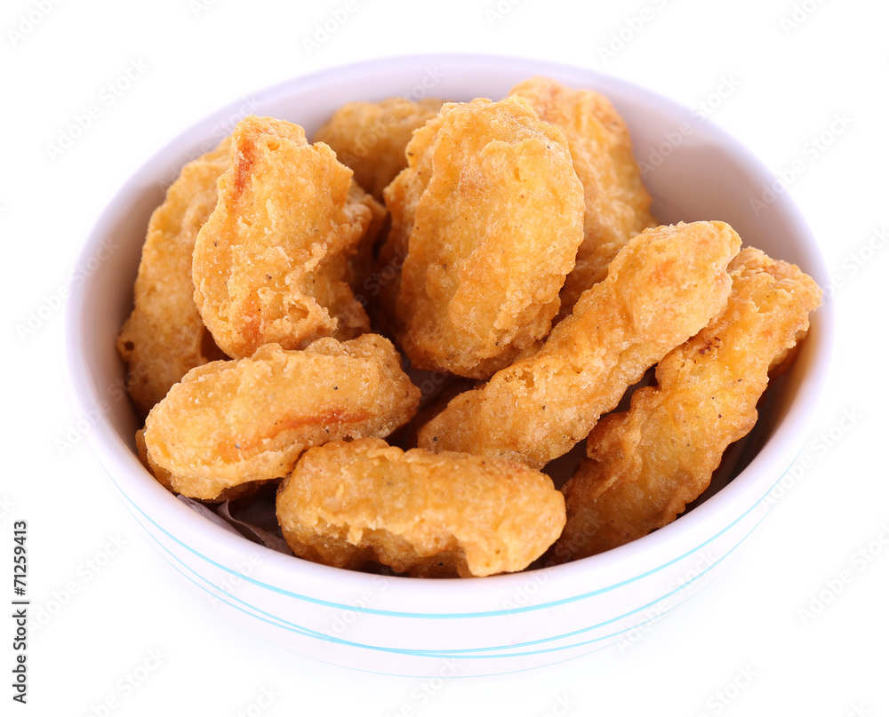 Fried chicken nuggets in bowl isolated on white Fried chicken nuggets in bowl isolated on white