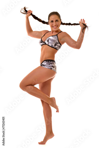 Beautiful sportive woman in underwear posing in studio.