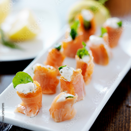Photo appetizer platter with smoked salmon, cream cheese, and arugula