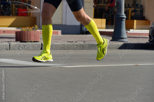 Running concept, man's legs run in sport shoes © Iuliia Sokolovska