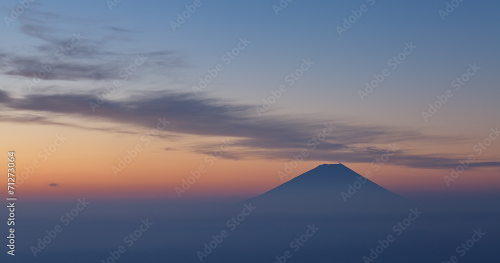 Top of Mountain Fuji and cloud at sunrise time