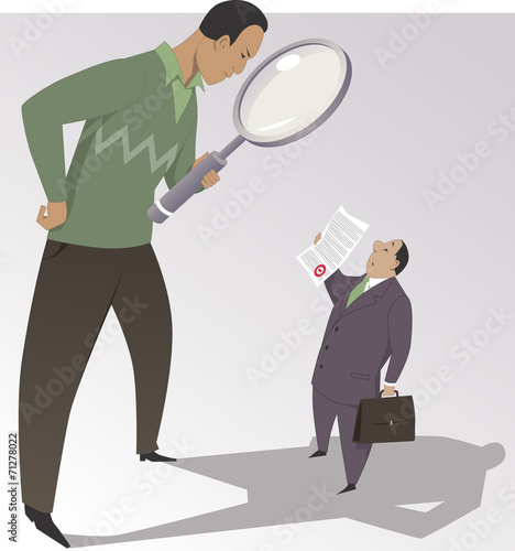 Photos Man with a magnifying glass reading the fine print