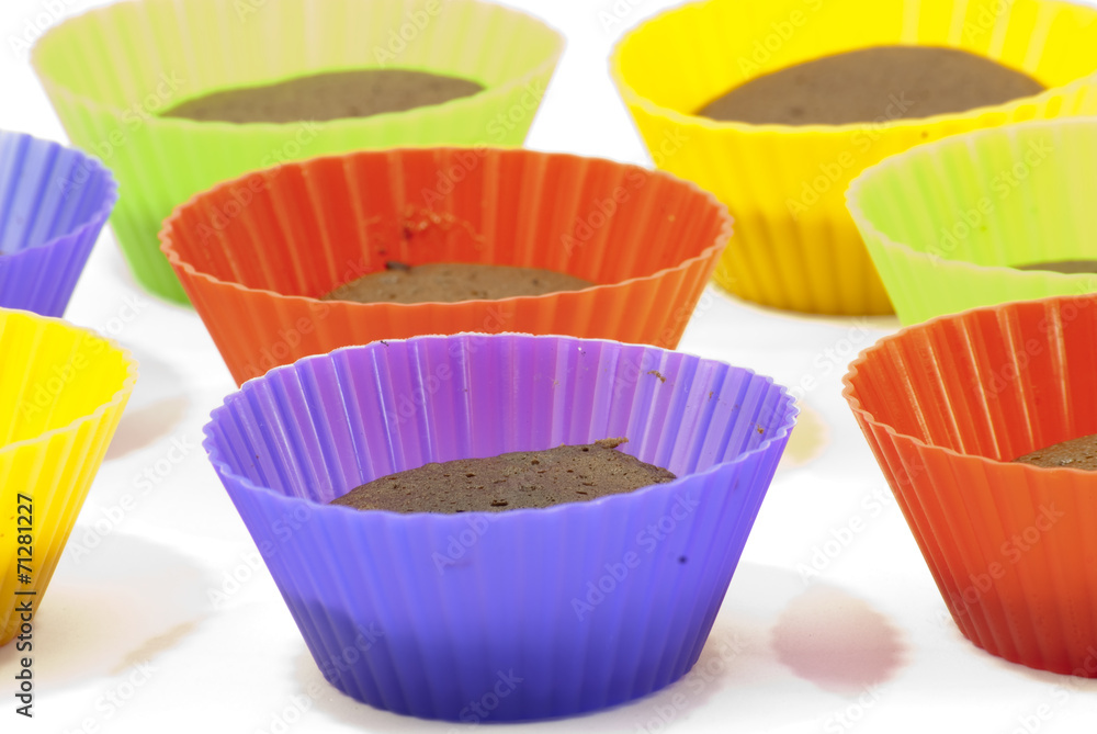 Chocolate muffins in silicone holders of many colors Chocolate muffins in silicone holders of many colors