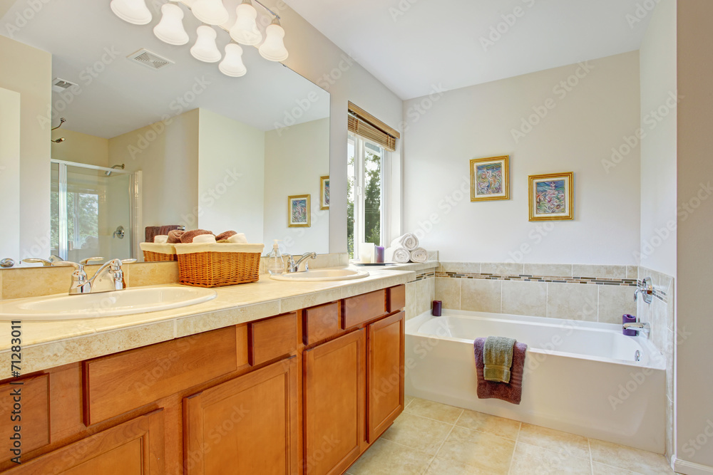 Bathroom with honey tone vanity cabinet Bathroom with honey tone vanity cabinet