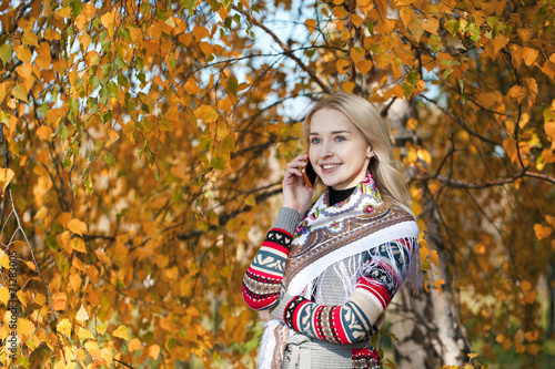 Portrait of a beautiful young woman calling by phone