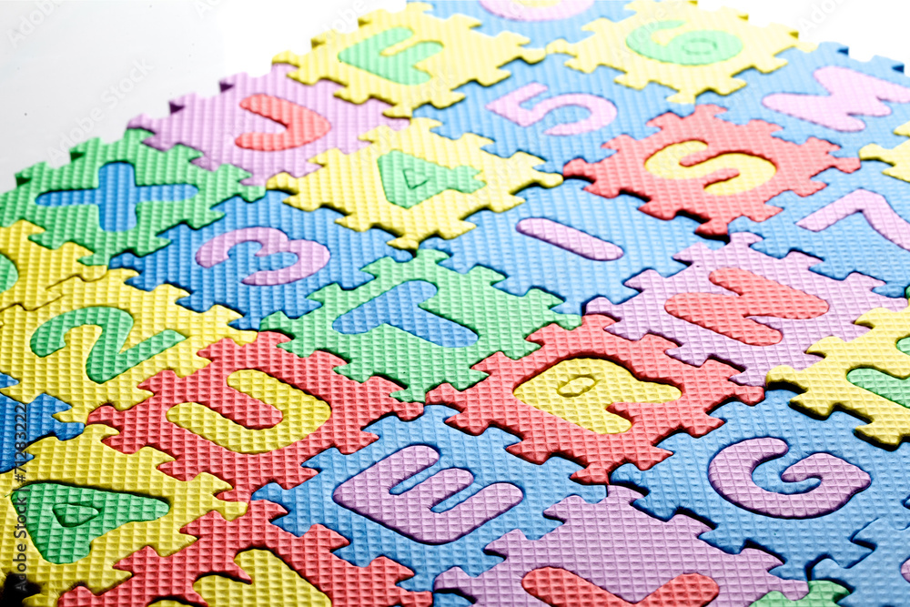 Multicolored plastic toy letters spelling the word Autism