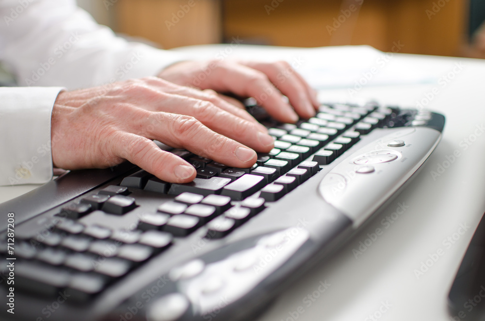 Hands typing on a keyboard Hands typing on a keyboard